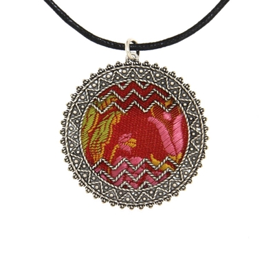 Silver filigree pendant with red brocade