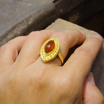 Gold ring with spessartite and diamonds