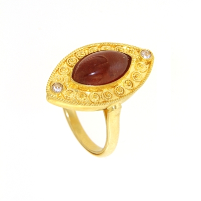 Gold ring with spessartite and diamonds