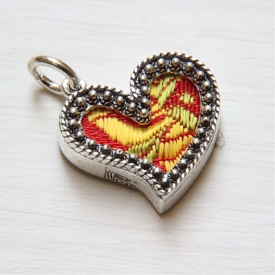 Silver heart pendant with red brocade