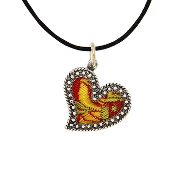 Silver heart pendant with red brocade